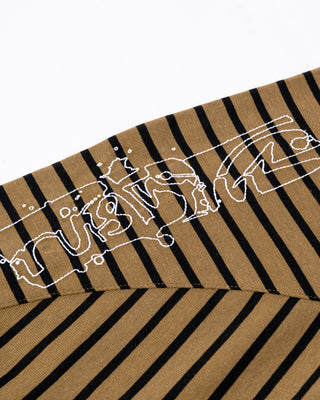 Man wearing Huff N Puff Long Sleeve Tee in Savanna