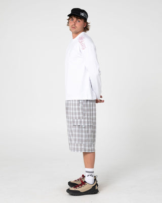 Man wearing Huff N Puff Long Sleeve Tee in White