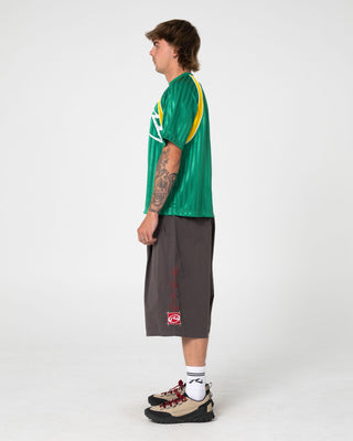 Man wearing Woopty Short Sleeve Sports Tee in Boston Green