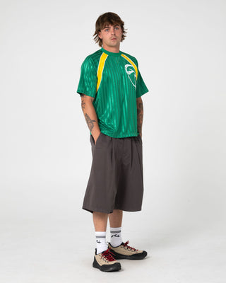 Man wearing Woopty Short Sleeve Sports Tee in Boston Green