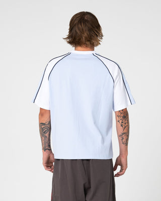 Man wearing Tekka Short Sleeve Tee in Sky Blue