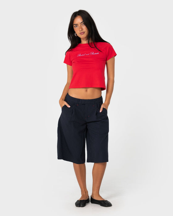 woman-wearing-big-bad-finance-mommy-low-rise-short-in-navy-pinstripe