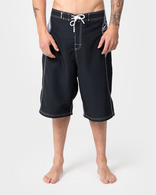Man wearing Oxecutioner Fixed Waist Boardshort in Black