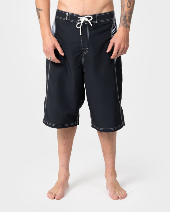 man-wearing-oxecutioner-fixed-waist-boardshort-in-black