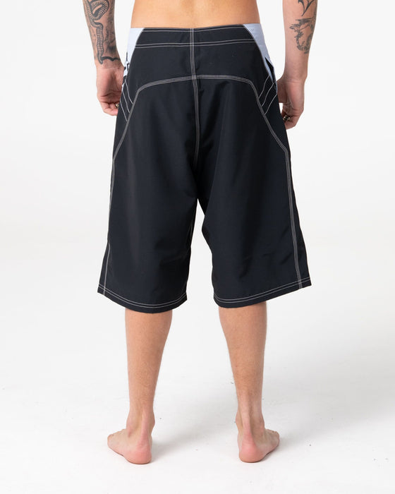 man-wearing-oxecutioner-fixed-waist-boardshort-in-black