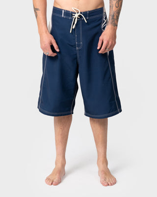 Man wearing Oxecutioner Fixed Waist Boardshort in Navy Blue