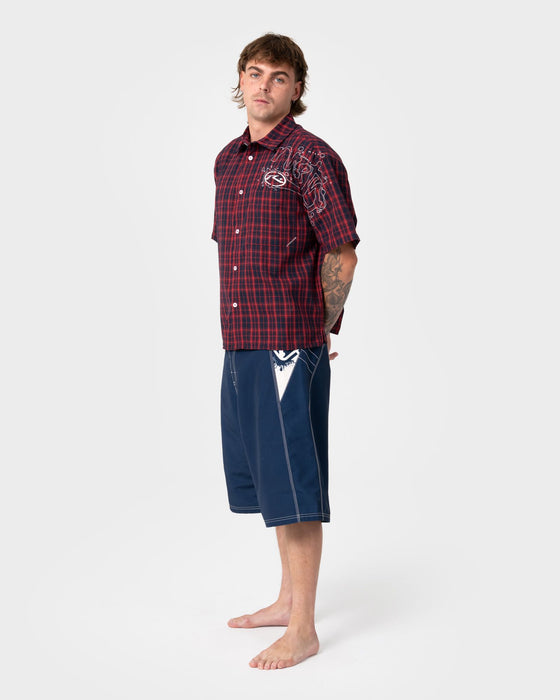 man-wearing-oxecutioner-fixed-waist-boardshort-in-navy-blue