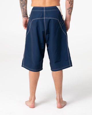 Man wearing Oxecutioner Fixed Waist Boardshort in Navy Blue