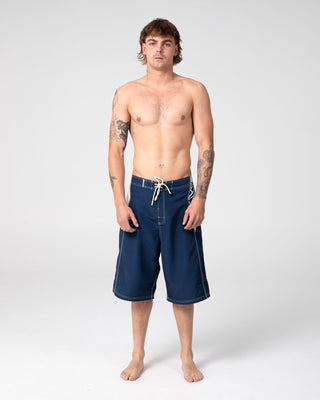 Man wearing Oxecutioner Fixed Waist Boardshort in Navy Blue