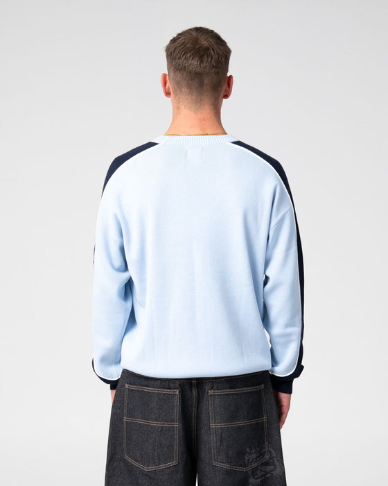 man-wearing-panela-anderson-knitted-crew-in-ice-blue
