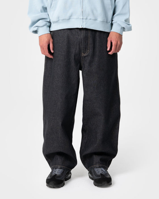 man-wearing-reload-cacoon-jean-in-raw-dawg-black