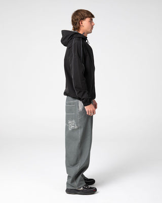 Man wearing Reload Cacoon Jean in Raw Dawg Slate