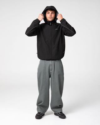 Man wearing Reload Cacoon Jean in Raw Dawg Slate