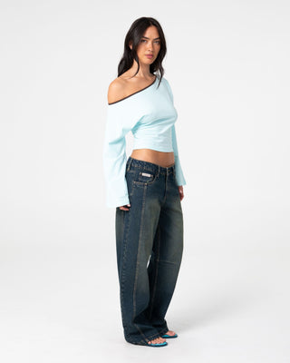 Woman wearing Yuno Reverse Long Sleeve Slouch Top in Powder Aqua