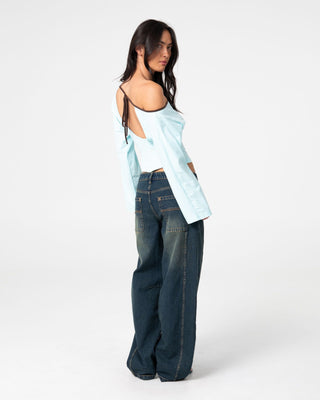 Woman wearing Yuno Reverse Long Sleeve Slouch Top in Powder Aqua