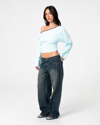 Woman wearing Yuno Reverse Long Sleeve Slouch Top in Powder Aqua