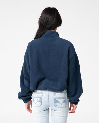 Woman wearing Two Tides Zip Through Sherpa Fleece in Navy / Light Blue