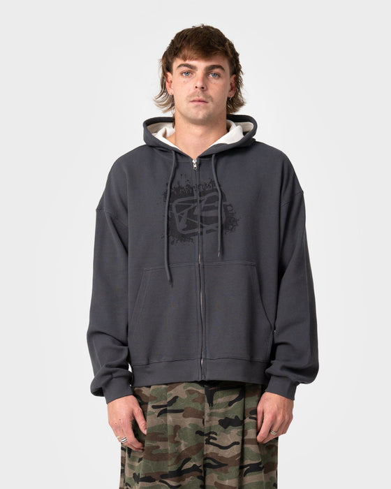 man-wearing-revolt-waffle-zip-thru-hooded-fleece-in-steel