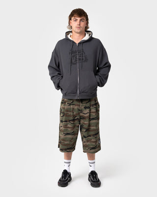man-wearing-revolt-waffle-zip-thru-hooded-fleece-in-steel