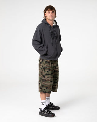 Man wearing Revolt Waffle Zip Thru Hooded Fleece in Steel