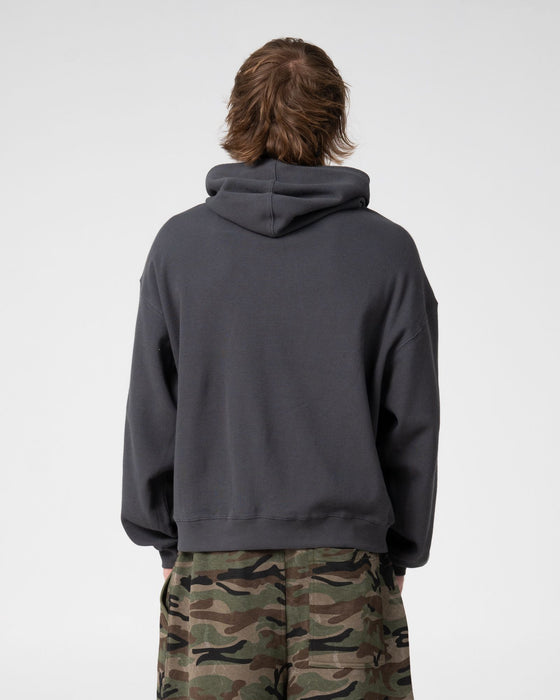 man-wearing-revolt-waffle-zip-thru-hooded-fleece-in-steel
