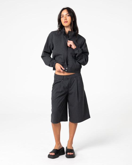 woman-wearing-road-rage-hardstyle-funnel-neck-jacket-in-coal-pinstripe