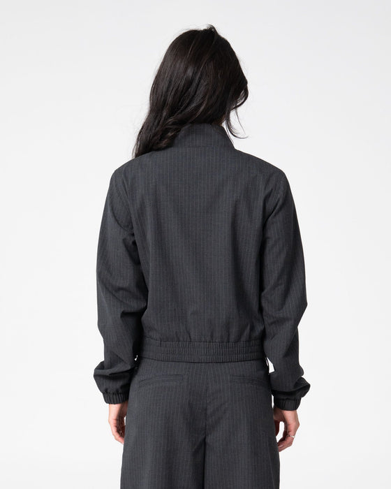 woman-wearing-road-rage-hardstyle-funnel-neck-jacket-in-coal-pinstripe