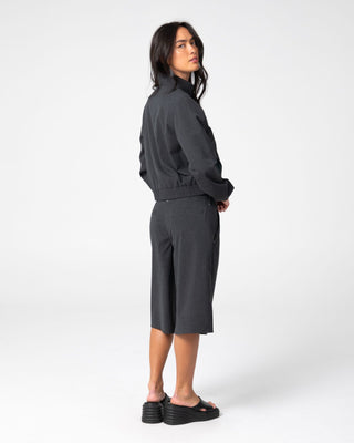 Woman wearing Road Rage Hardstyle Funnel Neck Jacket in Coal Pinstripe