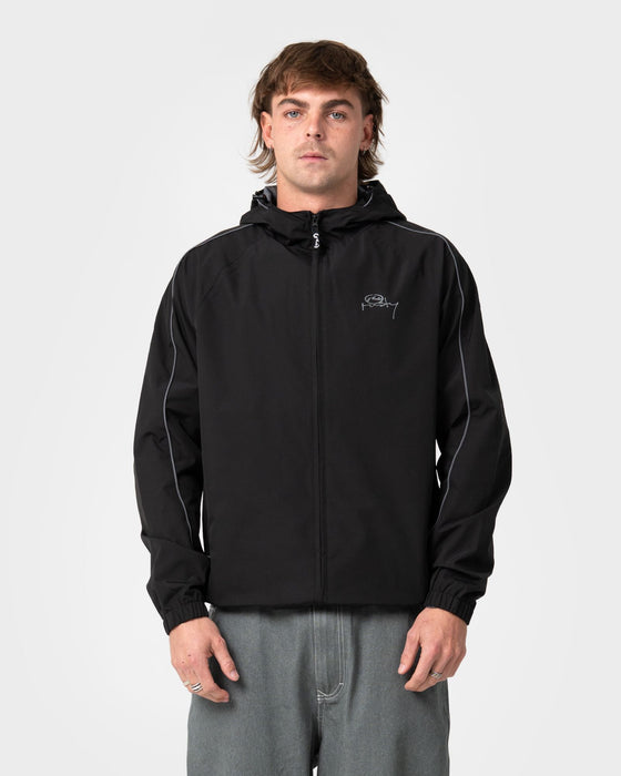 man-wearing-scyther-rain-jacket-in-black