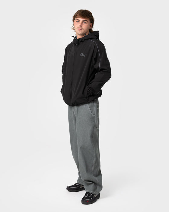 man-wearing-scyther-rain-jacket-in-black