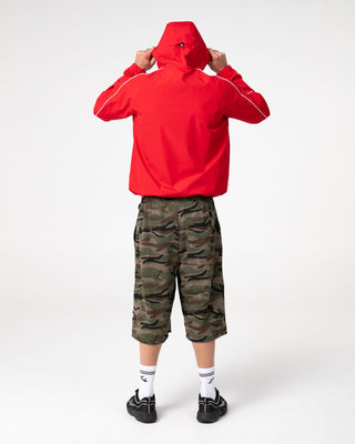 Man wearing Scyther Rain Jacket in Vintage Red