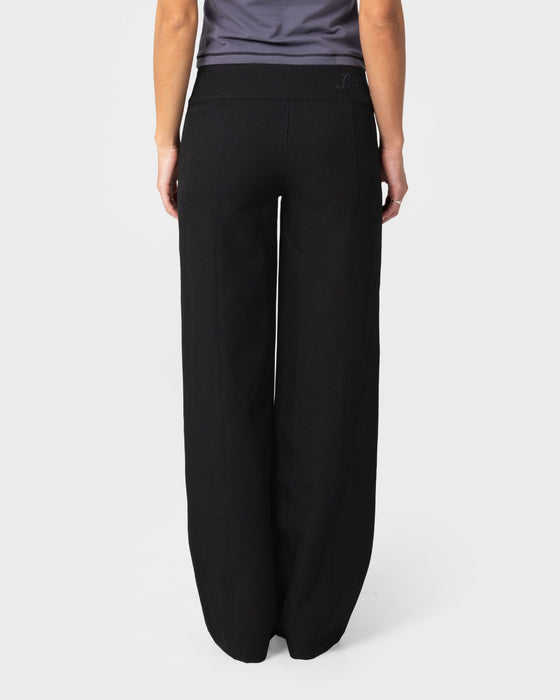 woman-wearing-business-mummy-low-rise-suit-pant-in-black