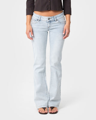 Woman wearing Lindsay Luv Low Rise Boot Leg Denim Jean in Worn Out