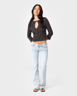 Woman wearing Lindsay Luv Low Rise Boot Leg Denim Jean in Worn Out