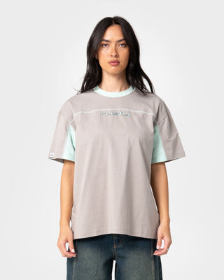Woman wearing Cyberwaves Oversize Short Sleeve Tee in Grey / Mint