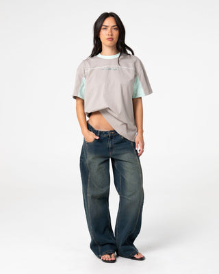 Woman wearing Cyberwaves Oversize Short Sleeve Tee in Grey / Mint