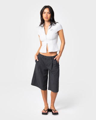 Woman wearing Siren Zip Through Short Sleeve Shirt in Ultimate Grey