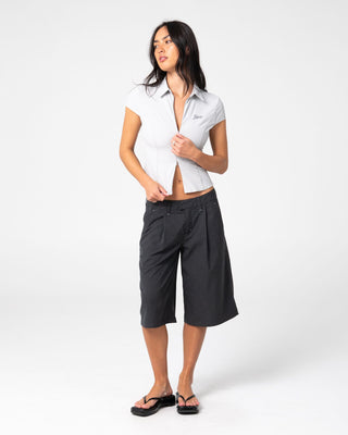 Woman wearing Siren Zip Through Short Sleeve Shirt in Ultimate Grey