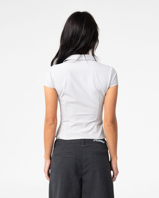 Woman wearing Siren Zip Through Short Sleeve Shirt in Ultimate Grey