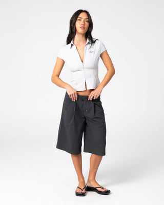 Woman wearing Siren Zip Through Short Sleeve Shirt in Ultimate Grey