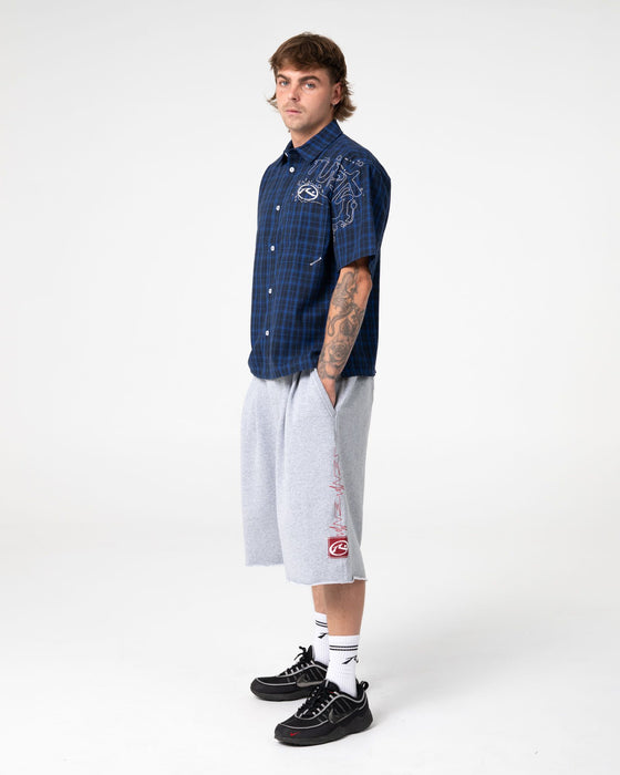 man-wearing-slick-rick-short-sleeve-shirt-in-royal-blue
