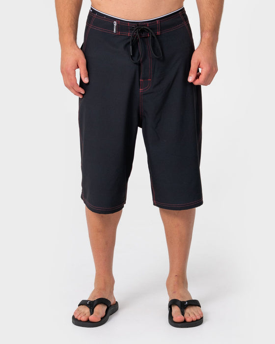 man-wearing-dragon-boosta-fixed-waist-boardshort-in-black