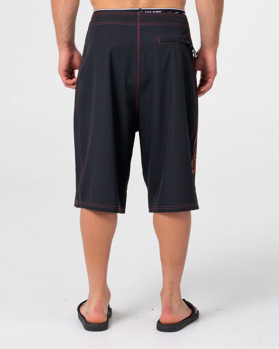 man-wearing-dragon-boosta-fixed-waist-boardshort-in-black