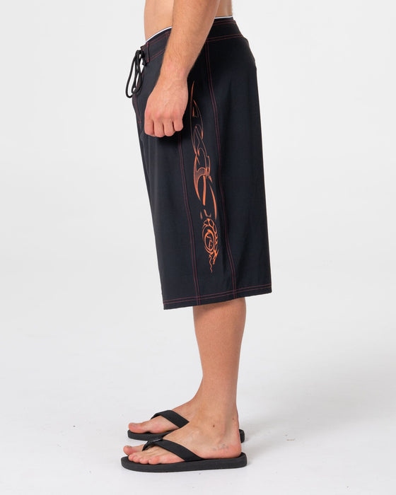 man-wearing-dragon-boosta-fixed-waist-boardshort-in-black