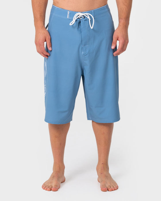 man-wearing-dragon-boosta-fixed-waist-boardshort-in-shadow-blue