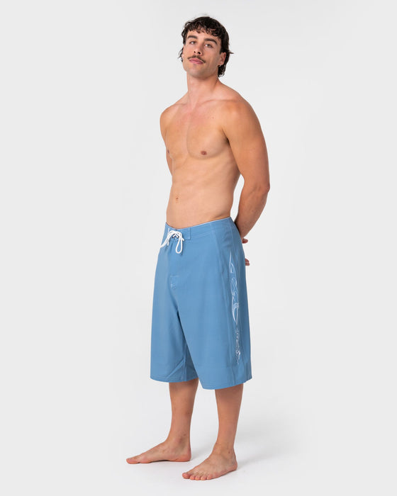 man-wearing-dragon-boosta-fixed-waist-boardshort-in-shadow-blue