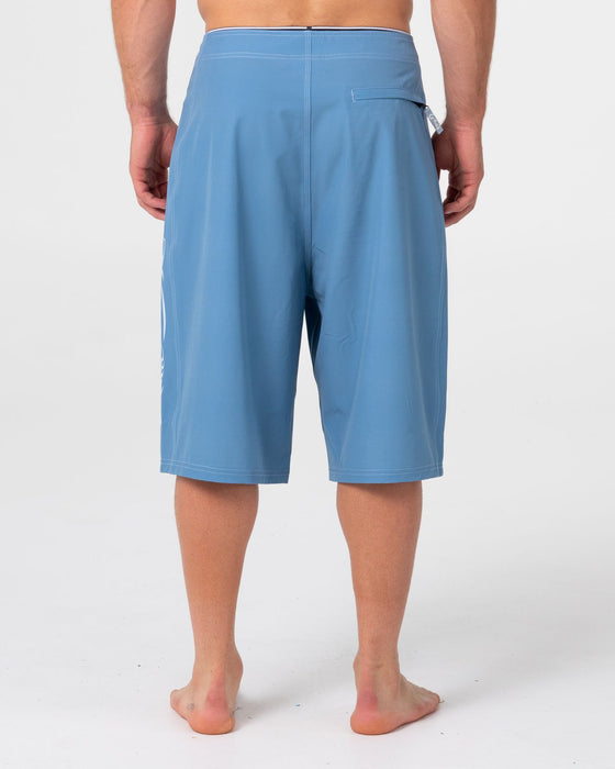 man-wearing-dragon-boosta-fixed-waist-boardshort-in-shadow-blue