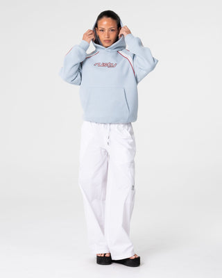 Woman wearing Tidal Wave Oversized Hooded Fleece in Retro Blue