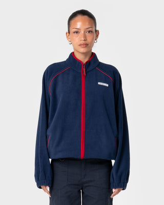 Woman wearing Bound Zip Through Fleece in Navy Blue