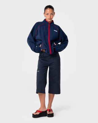 Woman wearing Bound Zip Through Fleece in Navy Blue